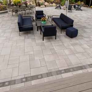 Elegant paver patio in Castle Pines featuring a variety of gray tones and a modern outdoor furniture set.