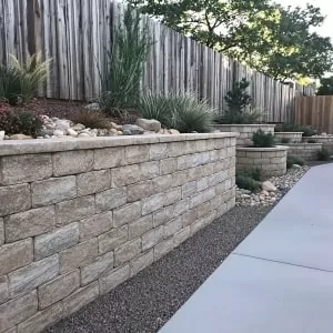 Sturdy and stylish retaining walls in a landscaped Castle Pines backyard.